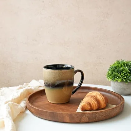 A Bosmarlin mug in a reactive glaze