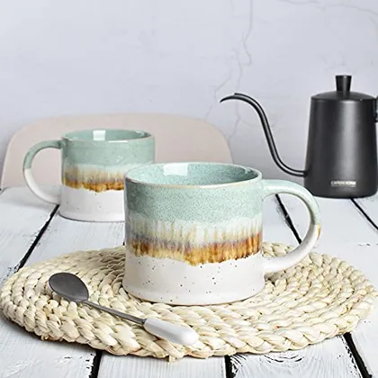A Bosmarlin mug in a reactive glaze