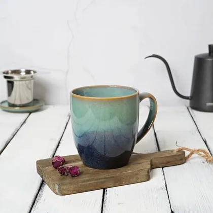 A Bosmarlin mug in a reactive glaze