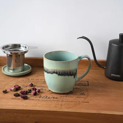 A Bosmarlin mug in a reactive glaze