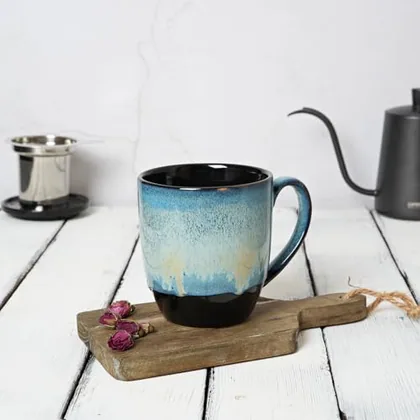 A Bosmarlin mug in a reactive glaze