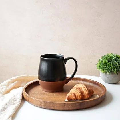 A Bosmarlin mug in a reactive glaze