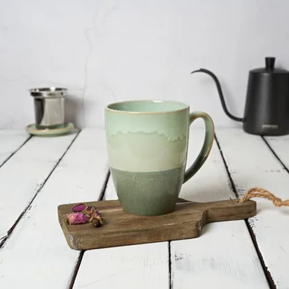 A Bosmarlin mug in a reactive glaze
