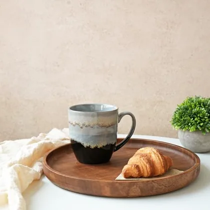 A Bosmarlin mug in a reactive glaze