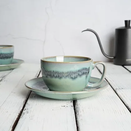 A Bosmarlin mug in a reactive glaze