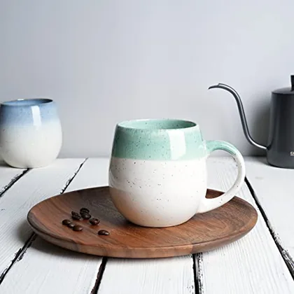 A Bosmarlin mug in a reactive glaze