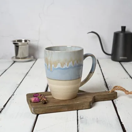 A Bosmarlin mug in a reactive glaze