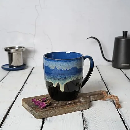 A Bosmarlin mug in a reactive glaze