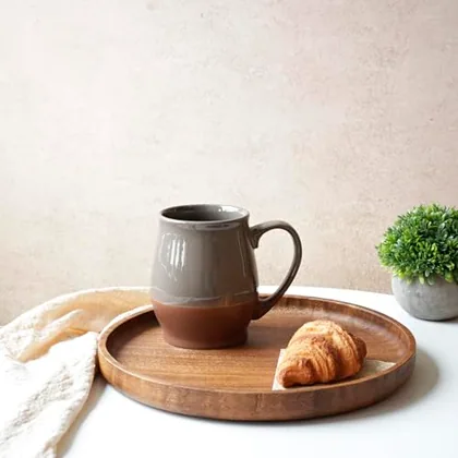 A Bosmarlin mug in a reactive glaze