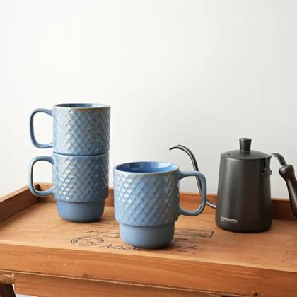 A Bosmarlin mug in a reactive glaze