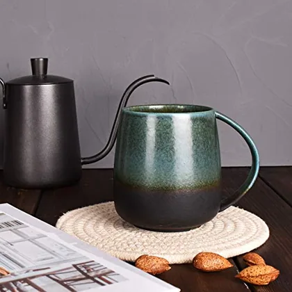 A Bosmarlin mug in a reactive glaze