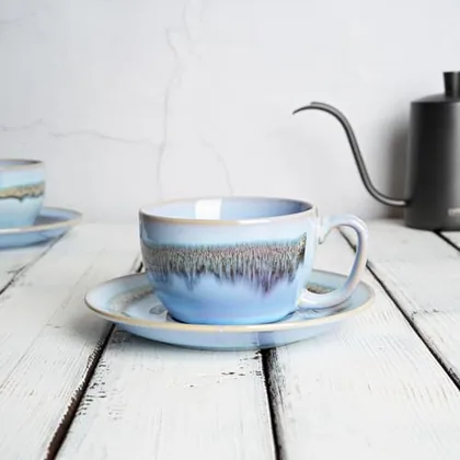 A Bosmarlin mug in a reactive glaze