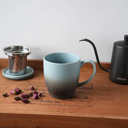 A Bosmarlin mug in a reactive glaze