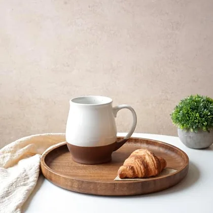 A Bosmarlin mug in a reactive glaze