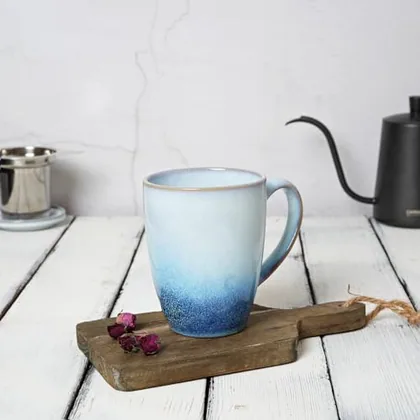 A Bosmarlin mug in a reactive glaze