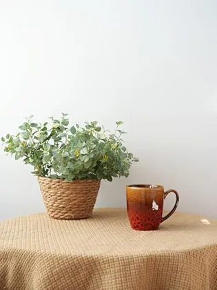 A Bosmarlin mug in a reactive glaze