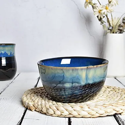 A Bosmarlin mug in a reactive glaze