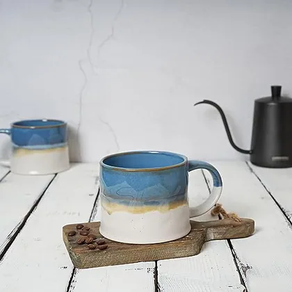 A Bosmarlin mug in a reactive glaze