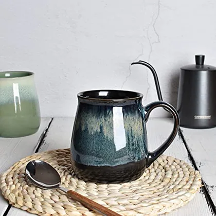 A Bosmarlin mug in a reactive glaze