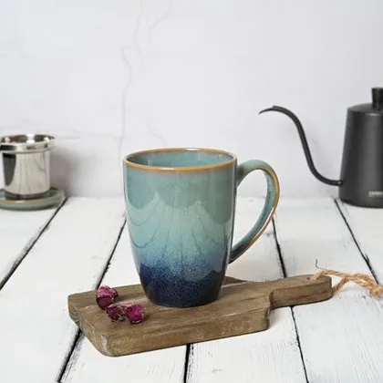 A Bosmarlin mug in a reactive glaze